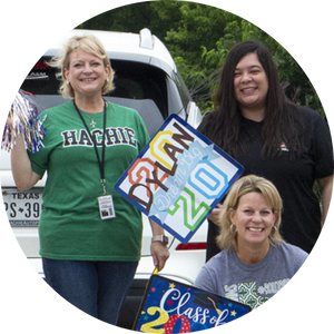 3 women holding congrats signs and pom poms